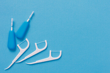 Top view of dental toothpicks on blue background - obrazy, fototapety, plakaty
