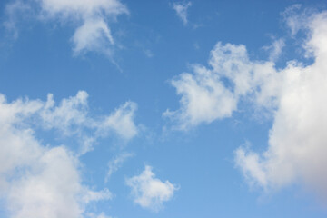 A blue sky with white layers of clouds is a common sight on a perfect, sunny day