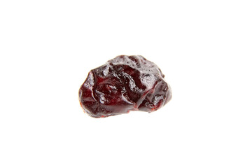 A solitary dried cranberry set against pure white backdrop. Close-up of a vibrant red cranberry