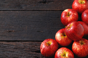 fresh red apples on the wooden floor