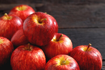 fresh red apples on the wooden floor