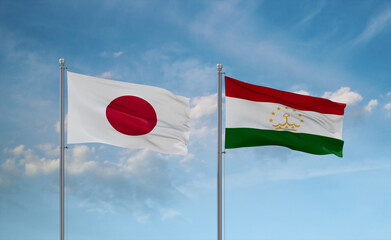 Tajikistan and Japan flags, country relationship concept