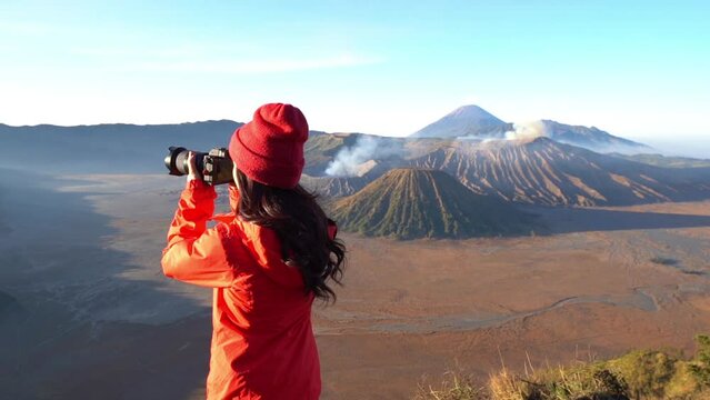 tourist Take pictures of Mount Bromo active volcano Located in Bromo. Tengger City Semeru National Park, East Java, Indonesia