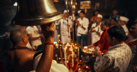 Hindu Religious Ceremony Traditions: of Group of Indian People Giving Offerings and Ringing Bells...