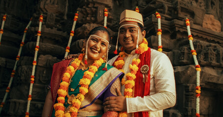 Portrait of Happy Indian Couple Looking at the Camera, Taking a Photo on Their Traditional Wedding....