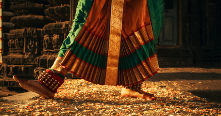 Close-Up Shot of the Legs of an Indian Female Dancer Doing a Folkloric Dance. Ground Level Shot of...