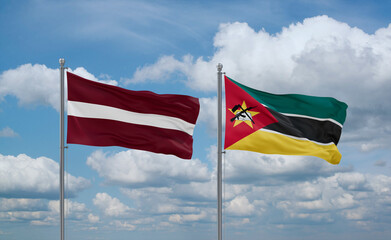 Mozambique and Latvia flags, country relationship concept