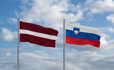 Slovenia and Latvia flags, country relationship concept