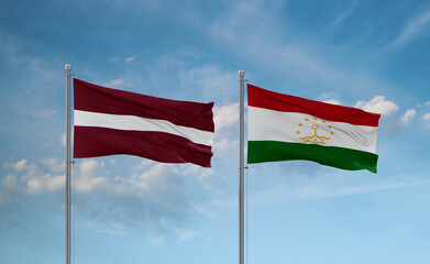 Tajikistan and Latvia flags, country relationship concept