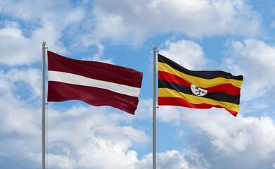 Uganda and Latvia flags, country relationship concept