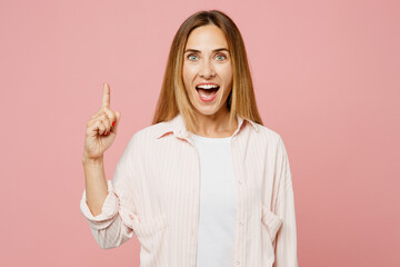 Young proactive happy woman she wear shirt white t-shirt casual clothes holding index finger up...