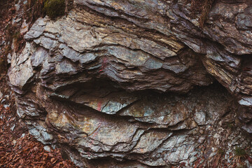 Texture cracked rock formation rock in the wild. Rocky cliff. Abstract Stone texture. Steep cliff of high mountain. Nature background, geological structure. Marble rocks in the wild. Detail Of Granite