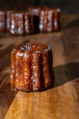 Canele, French pastry flavored with rum and vanilla, soft and tender custard center and  dark, caramelized crust specialty of Bordeaux region, France