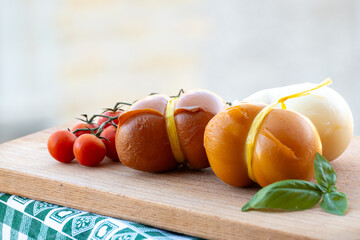 Italian semi hard handmade smoked scamorza cheese, from cow milk from Apulia or Calabria regions...