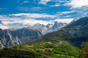 Naklejka na ściany i meble Panoramic view on Naranjo de Bulnes or Picu Urriellu, limestone peak dating from Paleozoic Era, located in Macizo Central region of Picos de Europa, mountain range in Asturias, North Spain