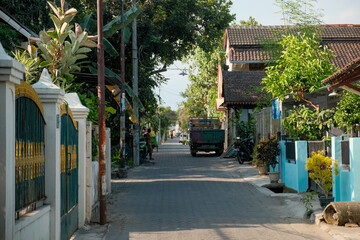 Residential Side Street in Sunny Yogyakarta, Lined with Trees