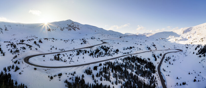 Sunset over Loveland Pass and mountain range in winter snow, Colorado, USA