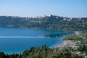 Fototapeta na wymiar Castel Gandolfo, view on green Alban hills overlooking volcanic crater lake Albano, Castelli Romani, Italy in summer