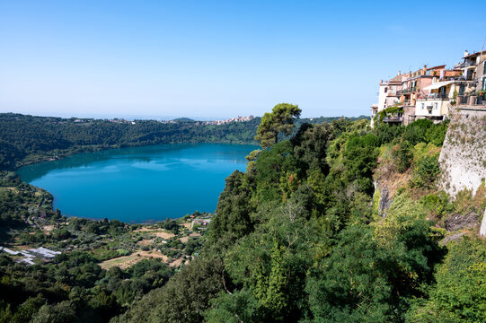 Small historical town Nemi, view on green Alban hills overlooking volcanic crater lake Nemi, Castelli Romani, Italy in summer