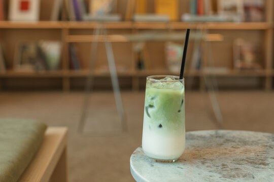 Close-up of a matcha latte on a marble table