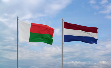 Netherlands and Madagascar flags, country relationship concept