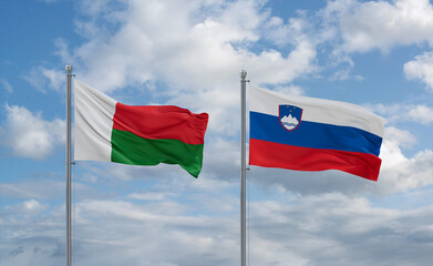 Slovenia and Madagascar flags, country relationship concept
