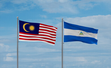 Nicaragua and Malaysia flags, country relationship concept