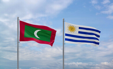 Uruguay and Maldives flags, country relationship concept