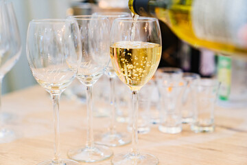Champagne is poured into a glass.