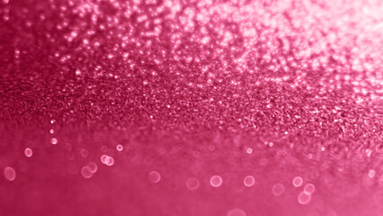 Viva Magenta sparkling festive background. 2023 color of the year glitter background, selective focus, blur effect