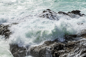 Large waves crush the coastline near Porto Covo, Portugal