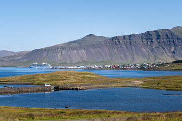 View of Grundarfj&ouml;r&eth;ur town and cruise ship at sea,  Sn&aelig;fellsnes peninsula, Iceland