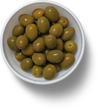 Top up view white ceramic bowl with green olives.
