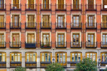 Windows on an antique apartment building at Plaza Mayor in Madrid, Spain