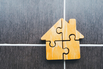 Housing jigsaw, Real Estate, unlocking property dreams with a house puzzle.