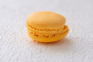 orange macaroons on a white background