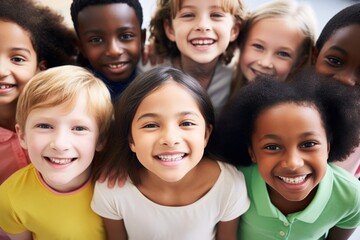 Happy diverse children group looking at camera. Smiling multiethnic kids posing for group portrait. Boys and girls of different skin colors play and have fun together. Diversity and free communication
