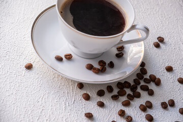 white cup of coffee with beans