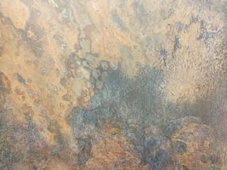 An old rusty wall with damage and stains. Grey metallic background.