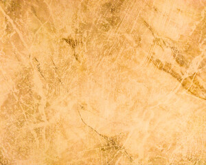 An old wall with scuffs and damage. Yellow metal background.