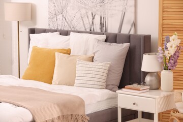 Light bedroom interior with comfortable modern bed