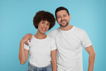 Obraz premium International dating. Portrait of happy couple on light blue background