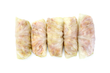 Uncooked stuffed cabbage rolls isolated on white, top view