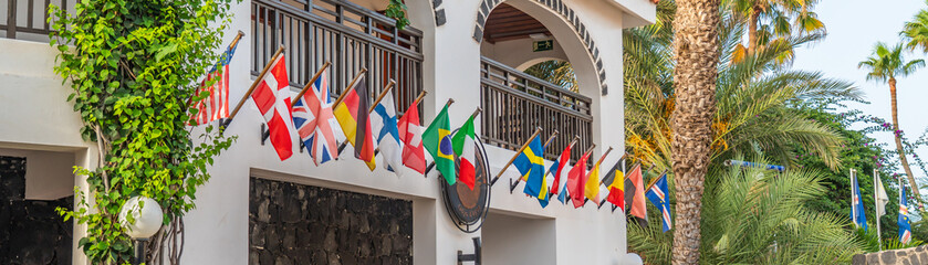 Flags of the Europeans countries in front of a Hotel building in Cape Verde