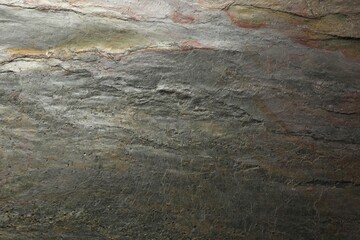 Texture of grey stone surface as background, closeup