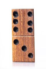 Domino tiles, handcrafted in wood, on white background, close-up