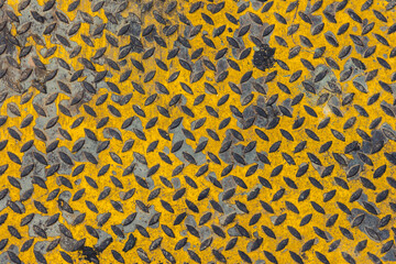 old grunge dirty steel pavement anti slip ground floor yellow color in heavy industry texture pattern for background