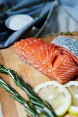 Fresh raw salmon fillet with seasonings and herbs