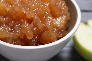 Delicious apple jam in bowl on table, closeup