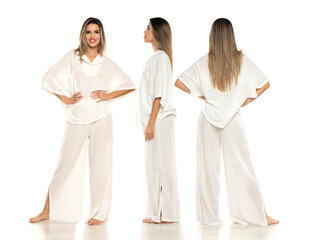 Collage of a young modern barefeet woman in white pants and blouse posing on white background.